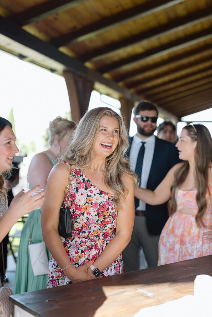 wedding guests enjoying a patio cocktail hour